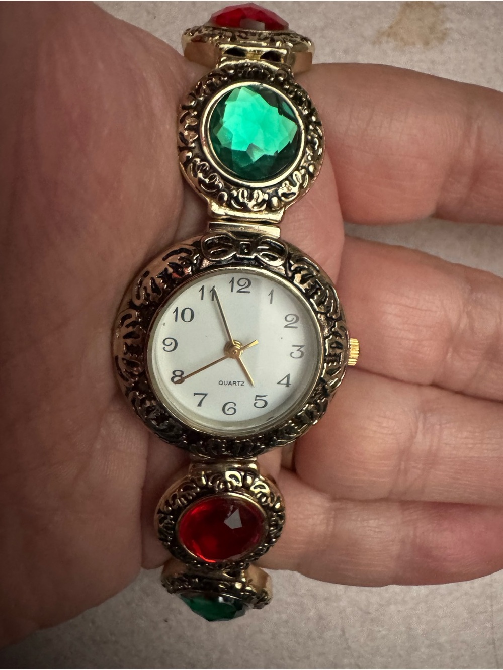 Macy’s Holiday Lane Gold-Tone Bracelet Watch with Green and Red Gem Accents